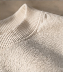 Macro of an undyed cotton knit collar